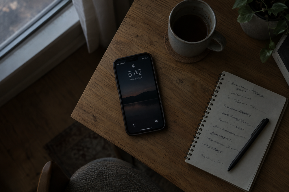 Phone with no service and low battery on table